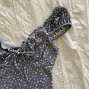 Blue floral bodysuit with cap sleeves and sweetheart neckline